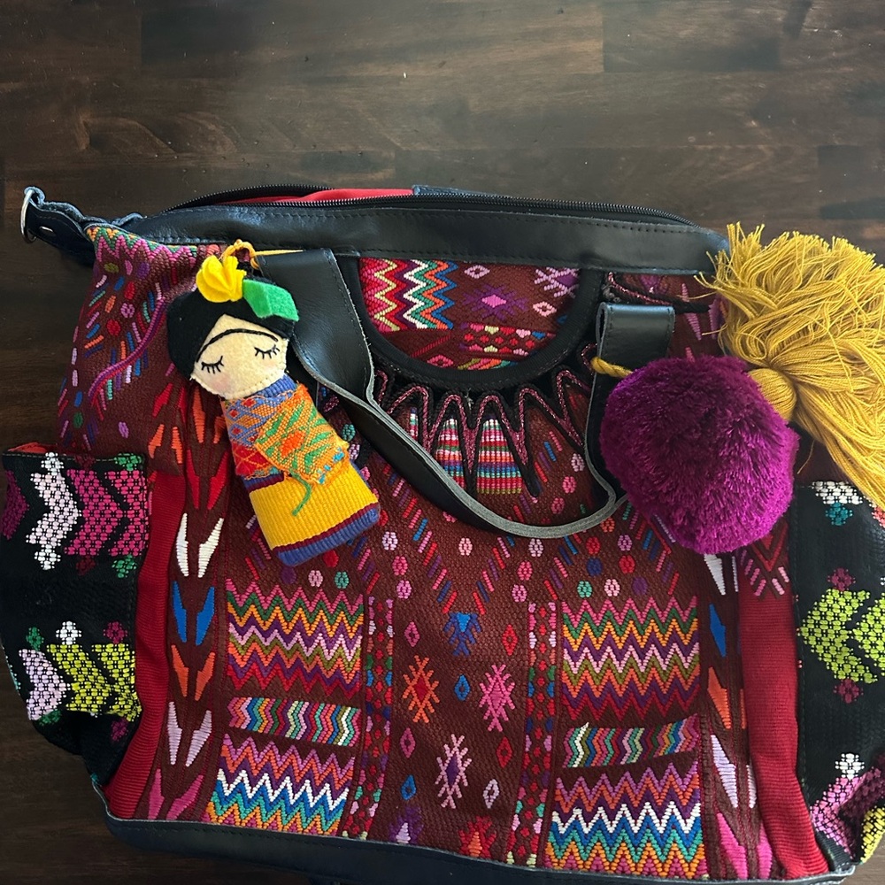 Nena& co black leather with Pom & doll gently used